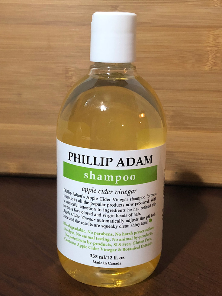 Apple cider vinegar is praised for being rich in vitamins and minerals good for hair, like vitamin C and B. Some also claim it contains alpha-hydroxy acid which helps exfoliate scalp skin, and that it's anti-inflammatory, which can help with dandruff.