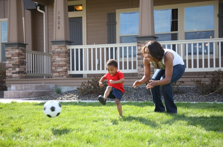 Mom & Son Playing Soccer